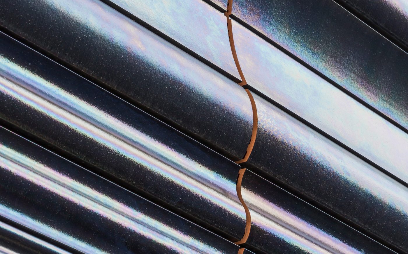 Reconversion and extension, including the premises of the GRED in a unique building which associates with the spaces of research for the premises of education (teaching), amphitheaters, a tree nursery of company and common premises. Differents elements of terracotta enamelled black iridescent are combined. CRBC, 26 place Henri Dunant 63000 CLERMONT FERRAND. Panels Argeton Double Peau Pétrole. 