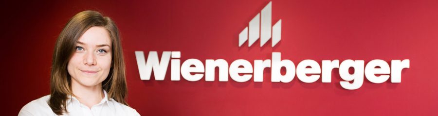 A landscape photo of Stephanie Palmer, UK Sustainability Manager with Wienerberger signage.