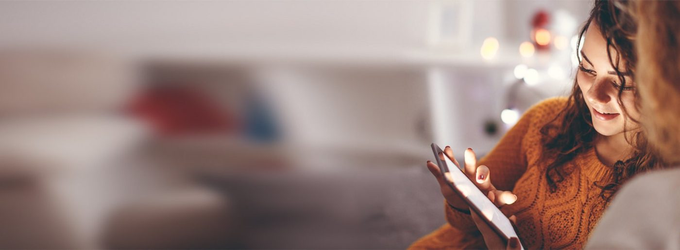 Woman scrolling through the website on an iPad